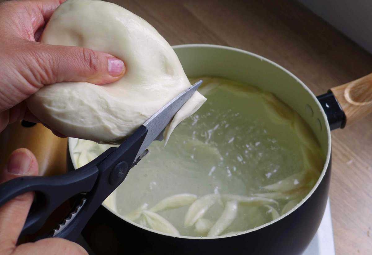 cutting noodles with scissors