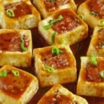 A plate of stuffed tofu with overlay text that says Chinese stuffed tofu