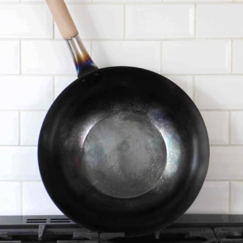 a newly seasoned carbon steel wok