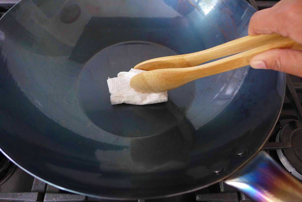 rubbing oil over a wok