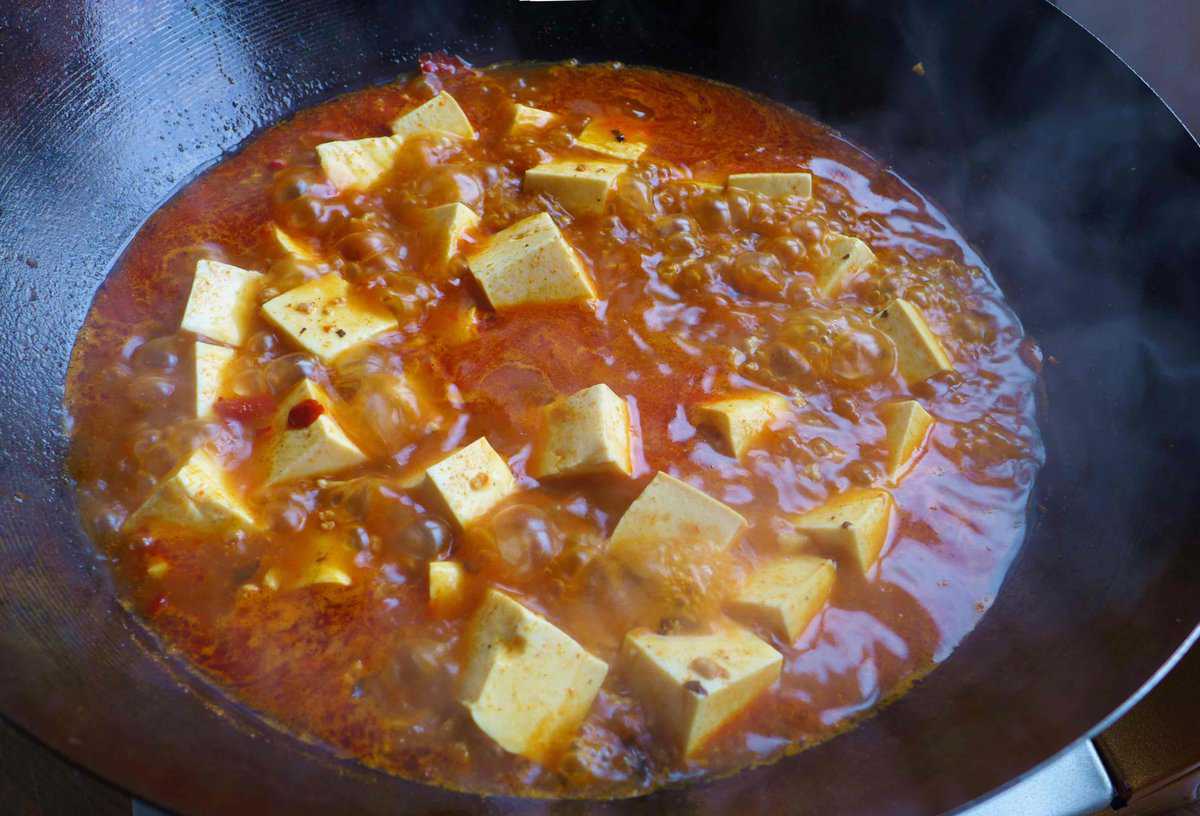 boiling tofu in a spicy liquid