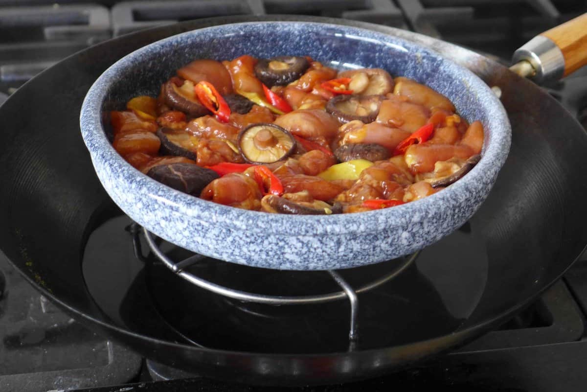 steaming chicken in a wok