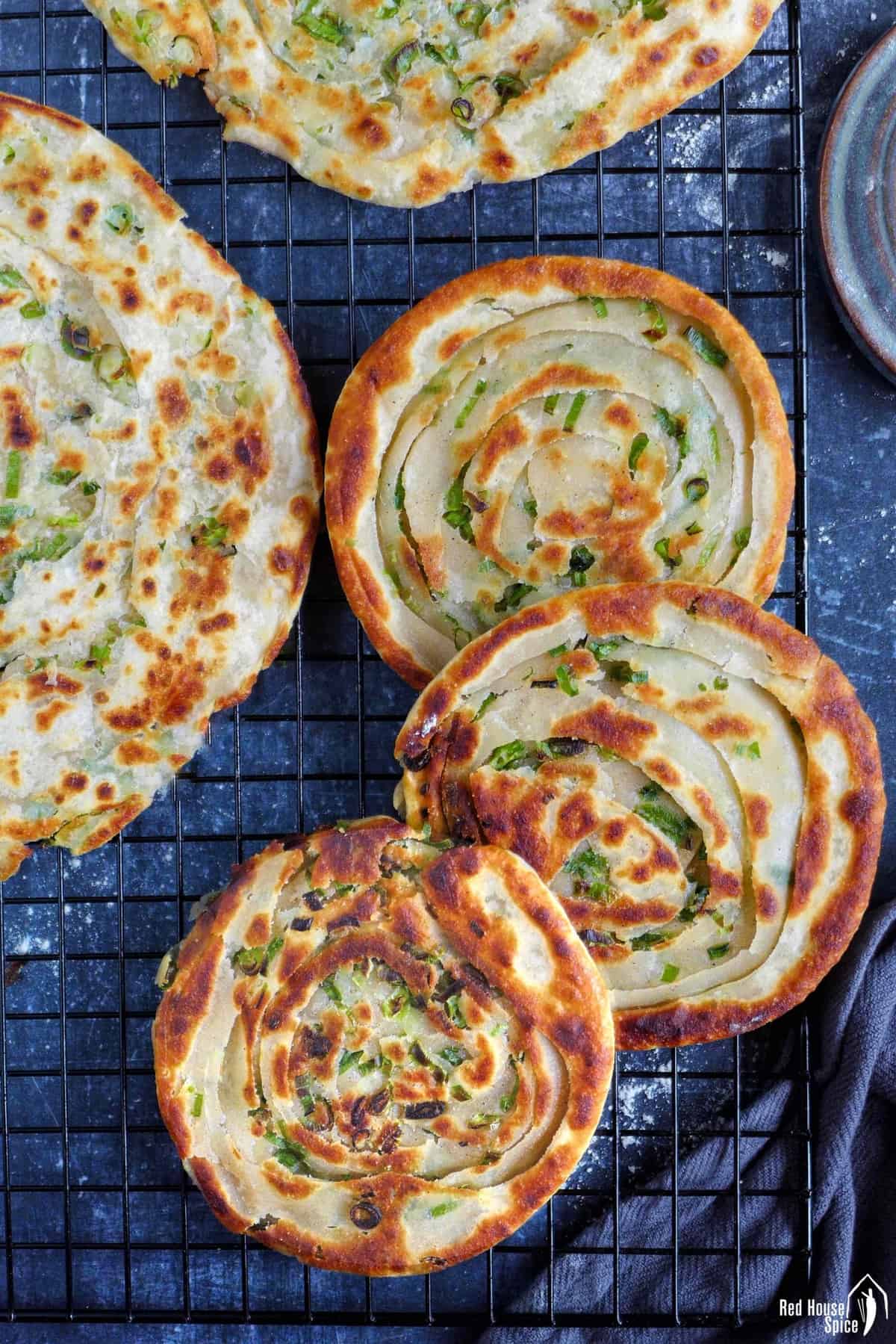 three thick scallion pancakes and two thin ones