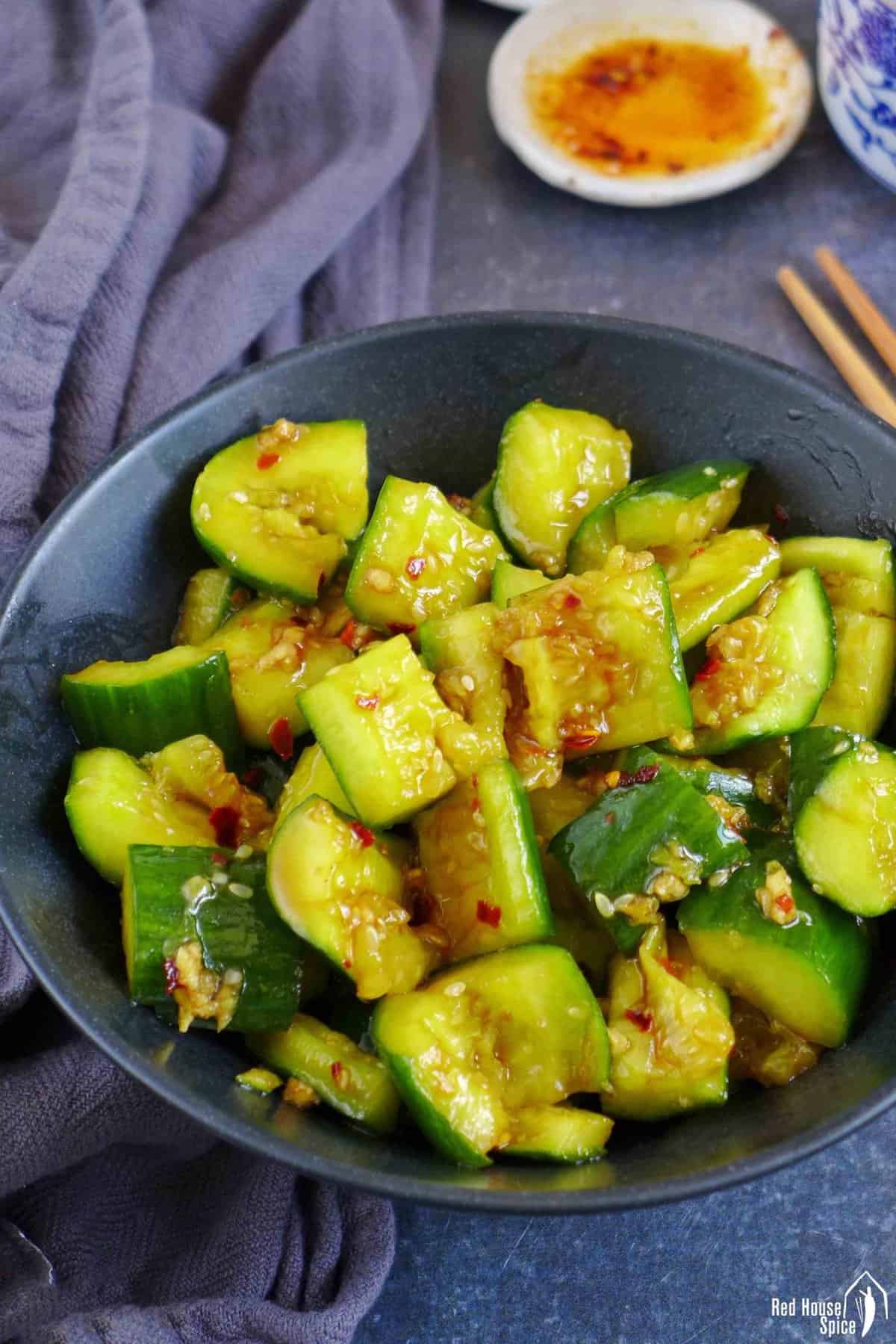 smashed cucumber salad with chilli oil on the side
