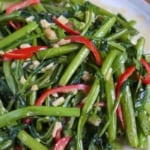 stir-fried water spinach with overlay text that says water spinach stir-fry