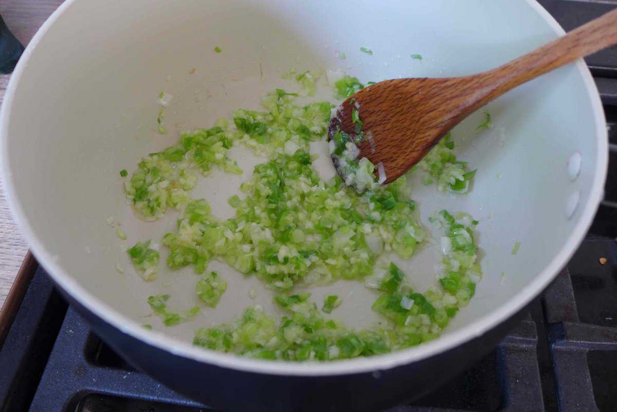 frying chopped scallions, ginger and garlic