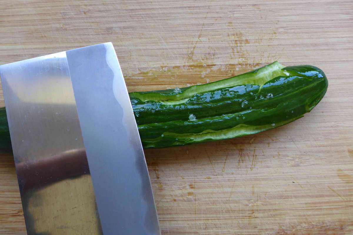 smashing cucumber with a cleaver