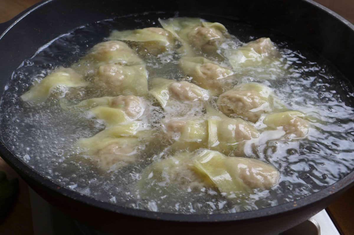boiling wontons in water.