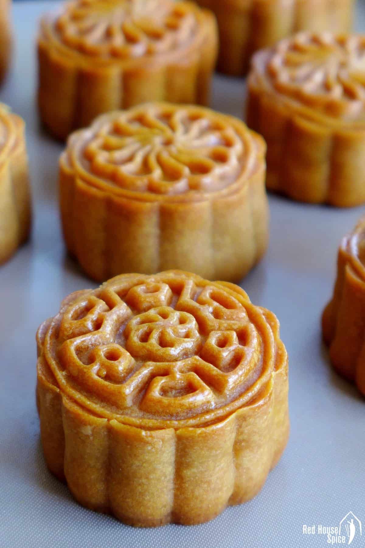 Baked round mooncakes.