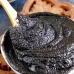 A bowl of black sesame paste with overlay text that says black sesame paste.