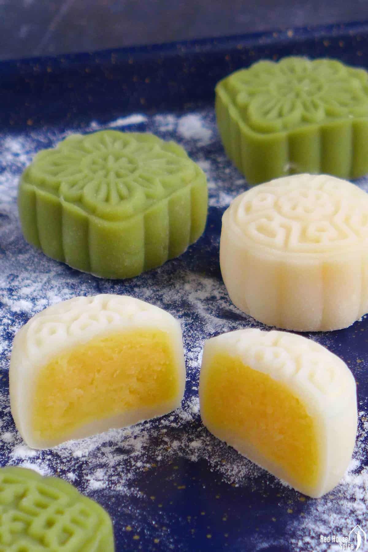 Snow skin mooncakes with one cut in halves.
