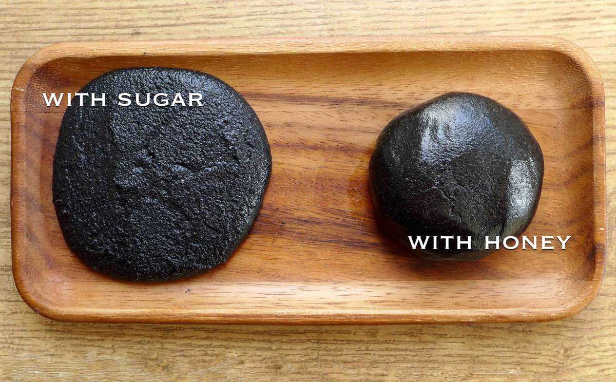 two portions of black sesame paste sweetened with sugar or honey.