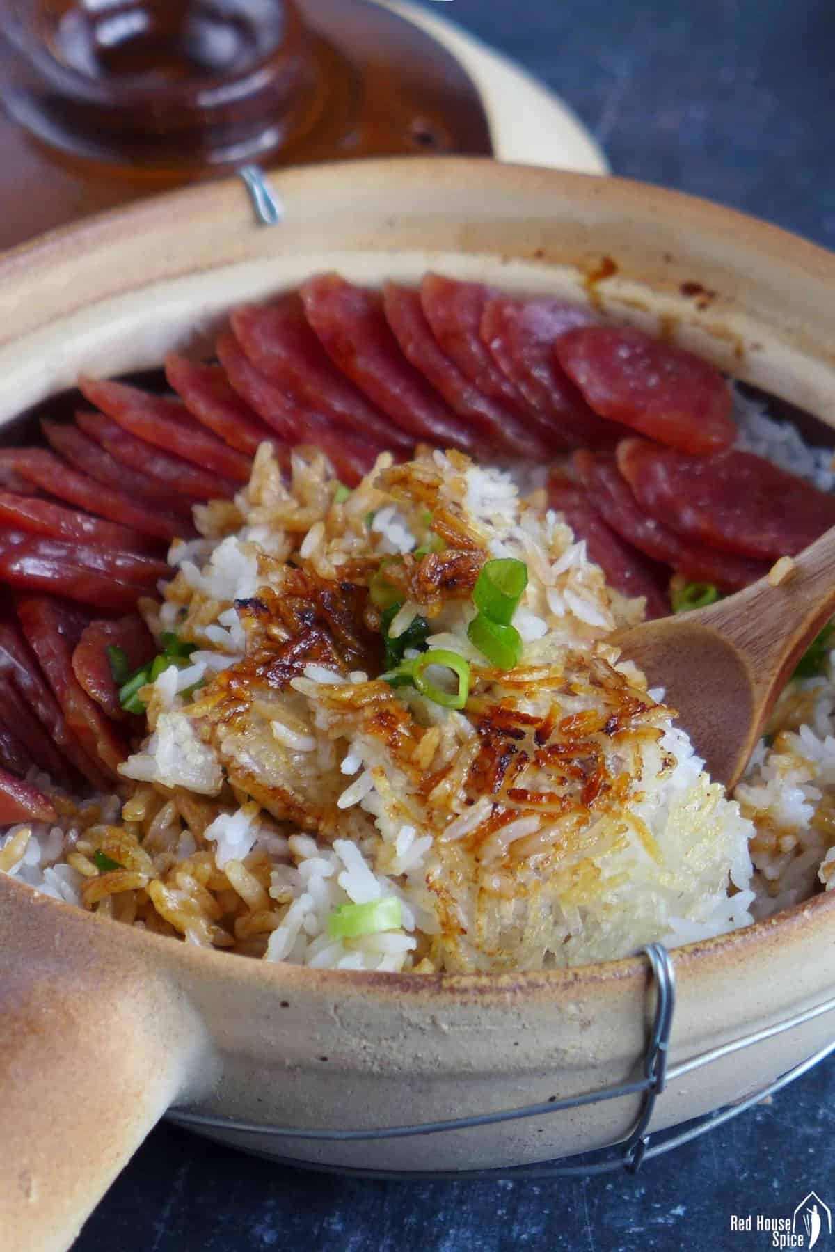 chinese sausage clay pot rice with crispy rice base.