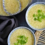 Egg drop soup in pot and bowls.