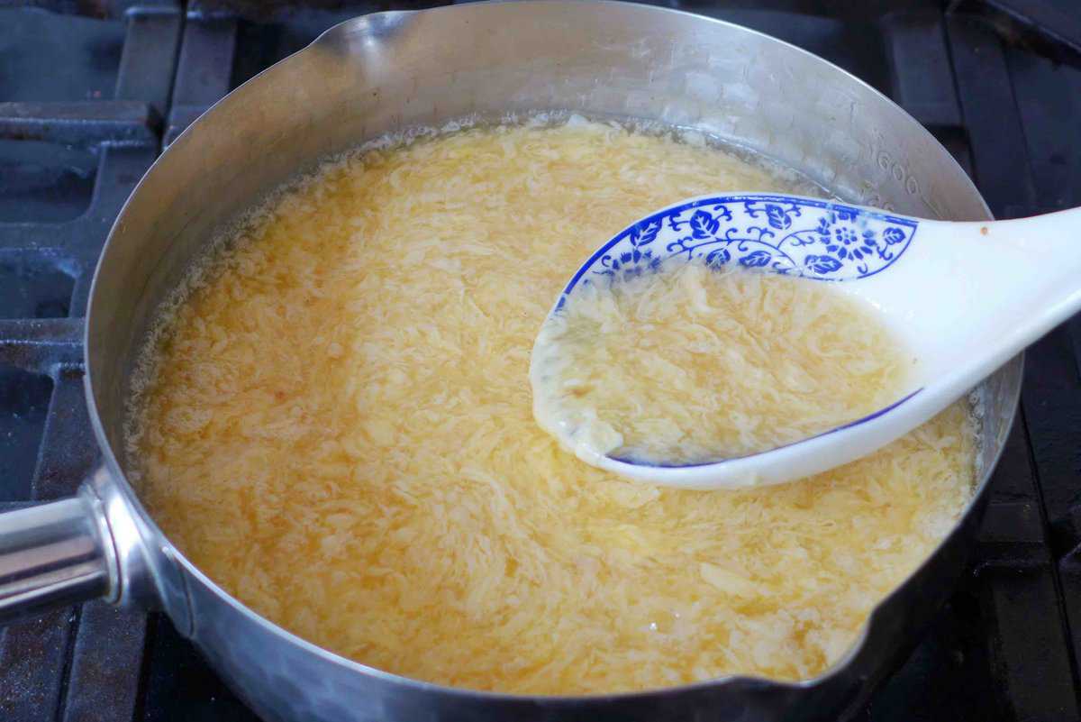 egg drop soup in a pot.