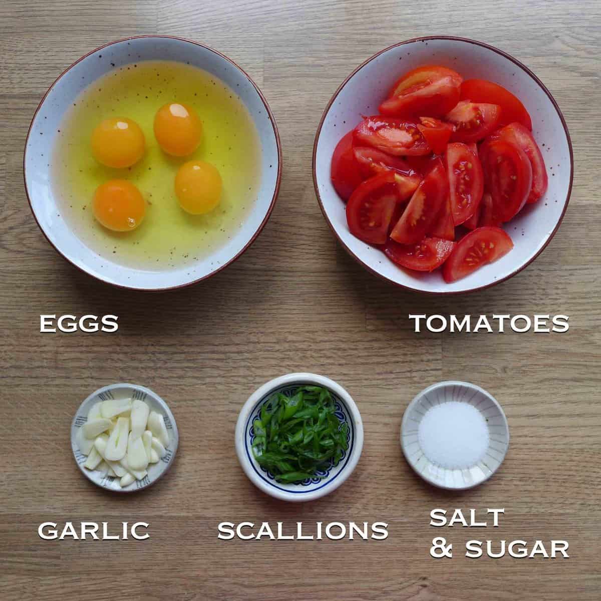 ingredients for cooking tomato egg stir-fry.