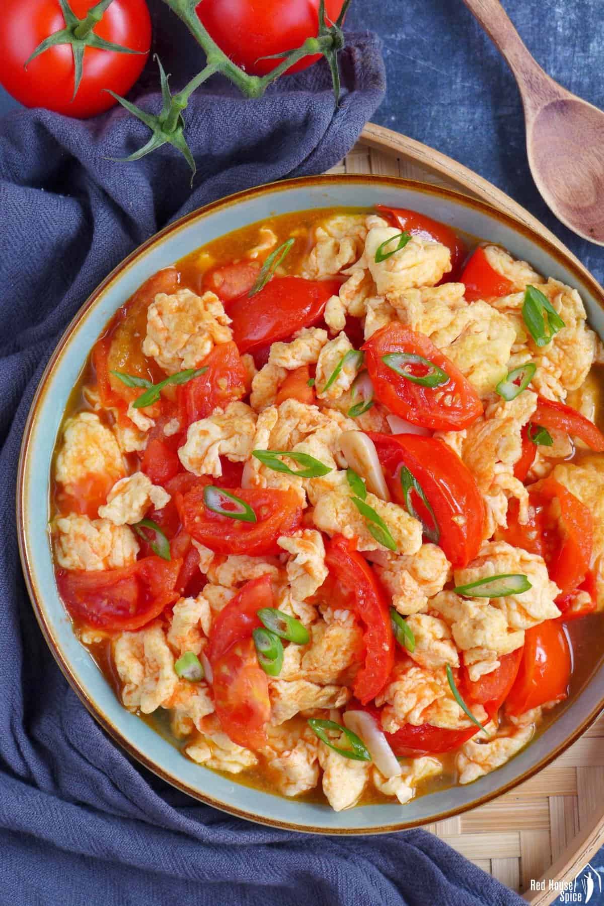 tomato and egg stir-fry in a plate.
