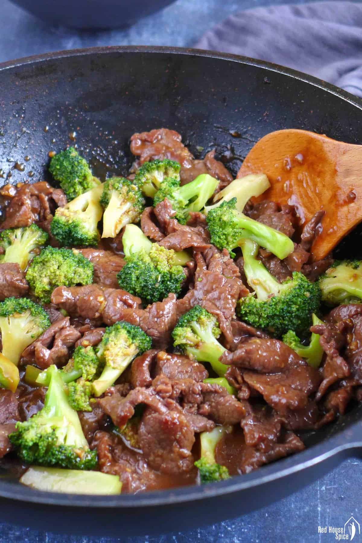 beef and broccoli in a wok.