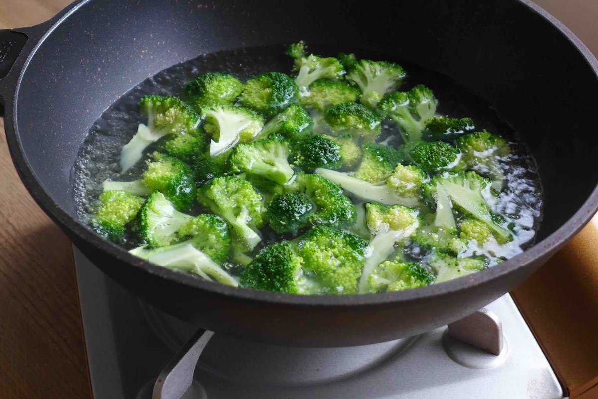 blanching broccoli in boiling water.