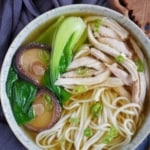 noodle soup with chicken and mushroom with overlay text that says chicken noodle soup.