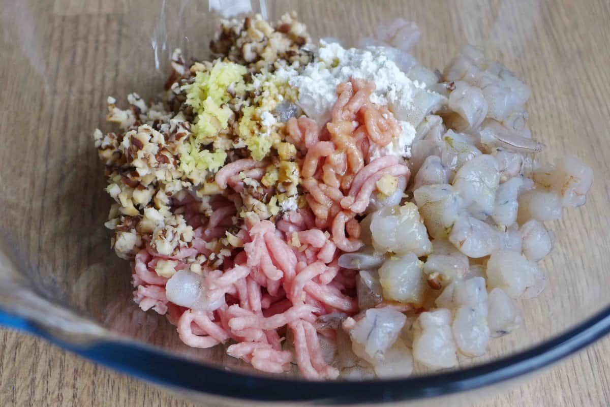 minced pork, shrimp, shiitake and seasonings in a bowl.