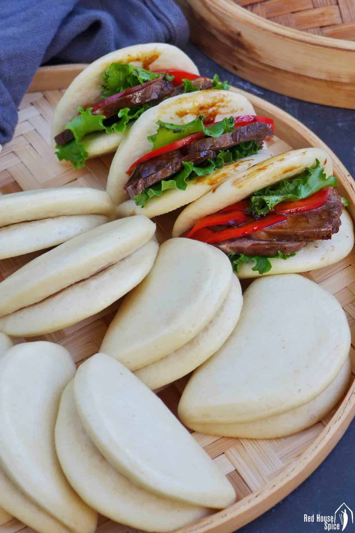 steamed bao buns. Some plain and some with fillings.