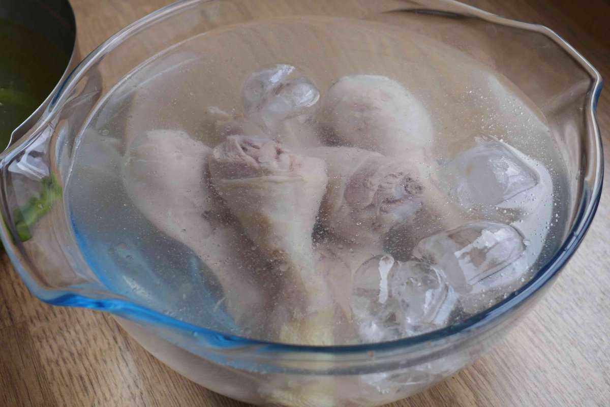 cooked chicken drums in icy water.
