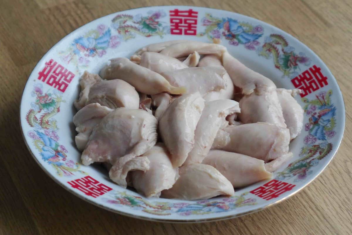 cooked chicken torn into pieces.