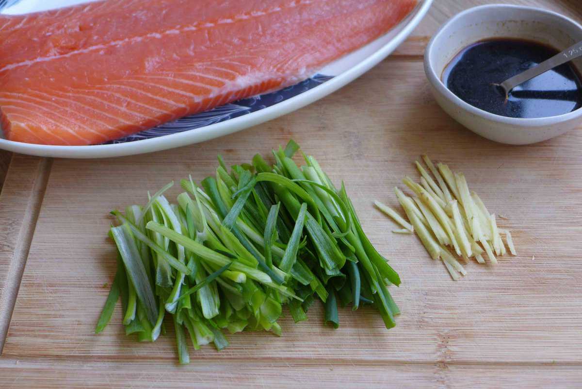 raw salmon, julienned scallion, ginger and a small bowl of dark sauce.