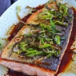 pan-fried salmon with fried scallions, ginger and a soy sauce dressing.