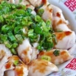 poached chicken with scallion oil and soy sauce.