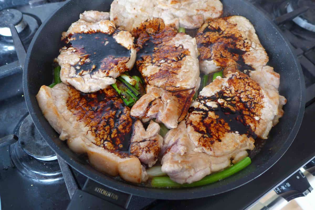 soy sauce over seared pork chops.