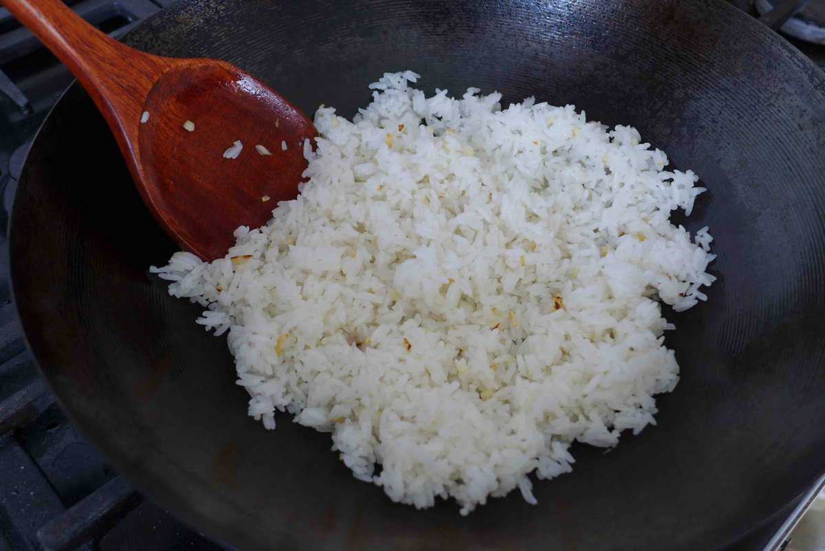 cooked rice in a wok.