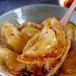 A Sichuan dumpling in a spoon.