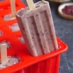 Pulling a red bean popsicle out of a mold.