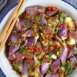 a plate of steamed eggplant with chili garlic dressing with overlay text that says chili garlic eggplant.
