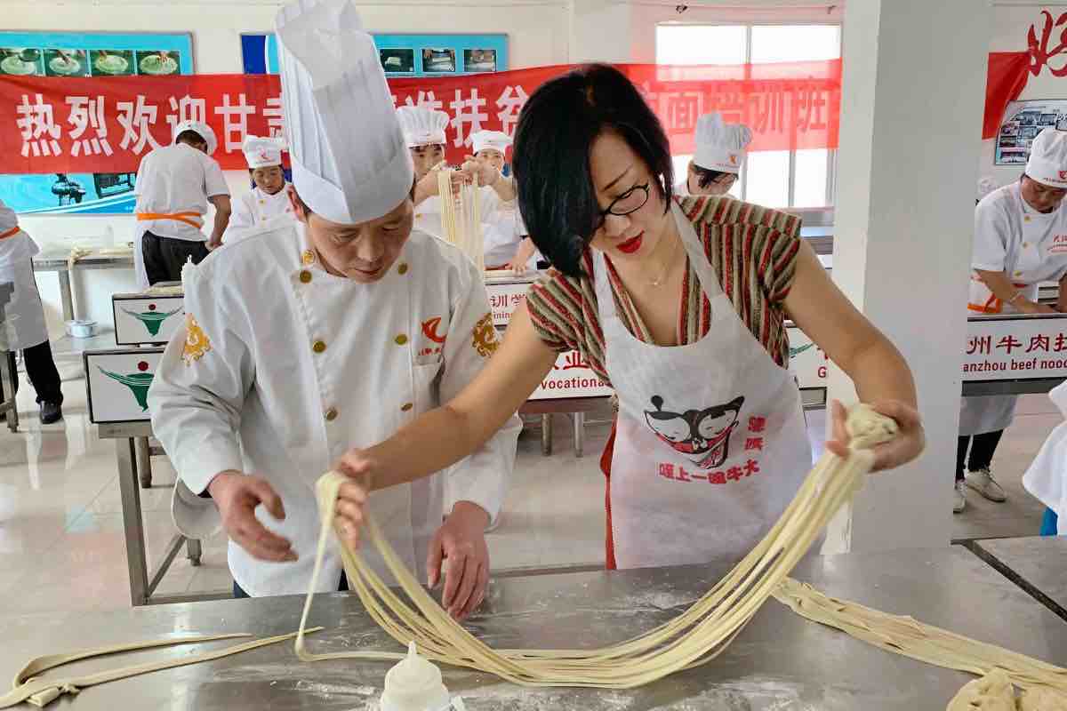Wei Guo learns pulling noodles in Lanzhou.