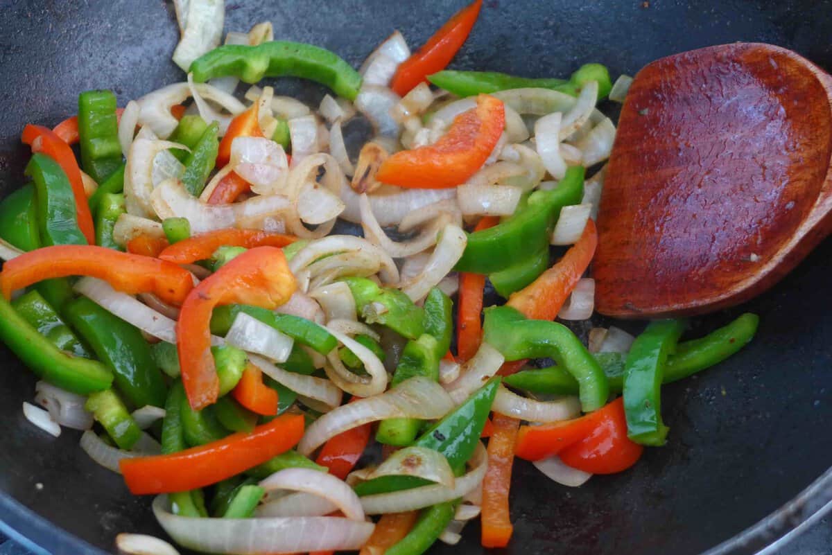 stir-frying onion and pepper.