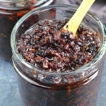 black bean sauce with a spoon.