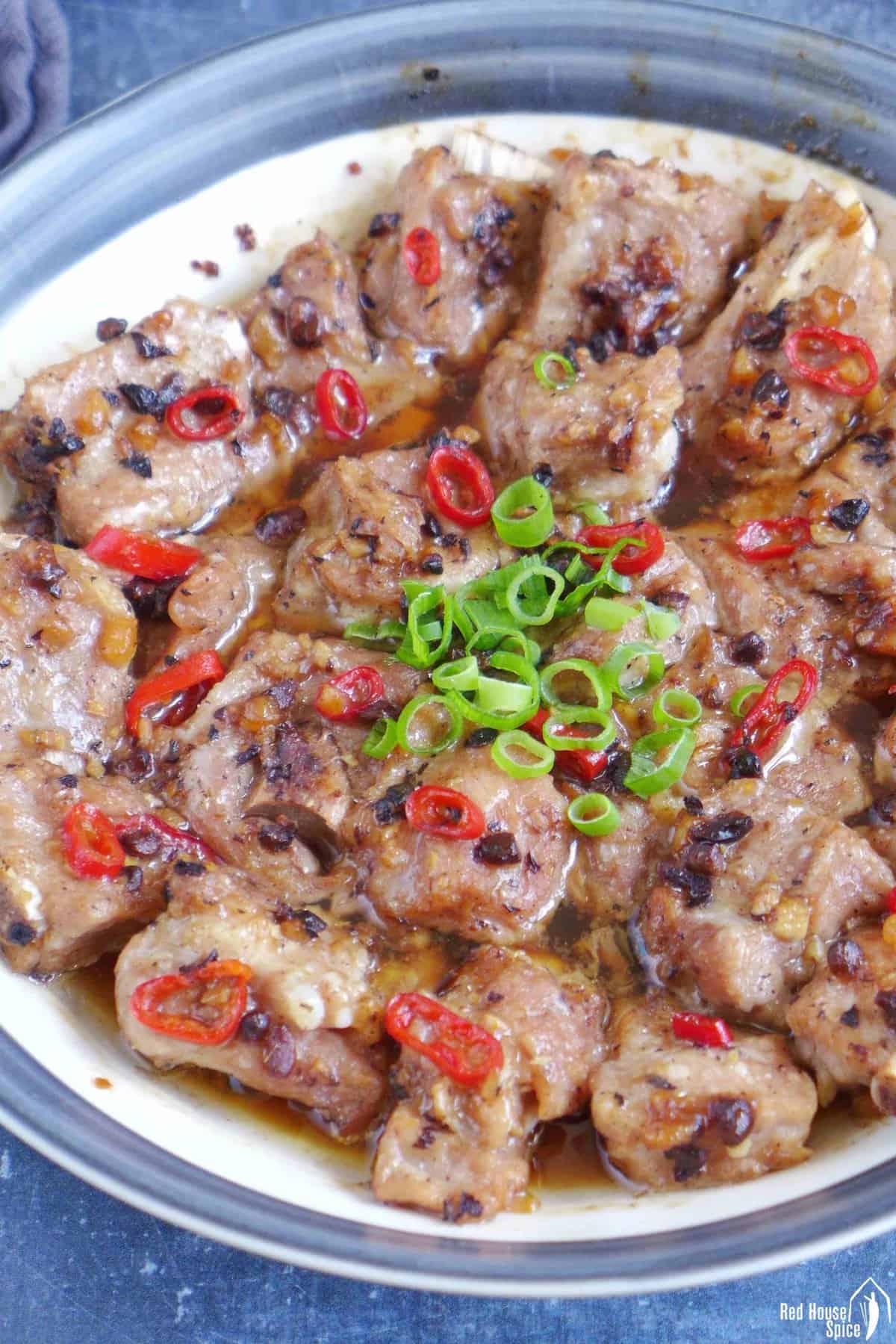 a plate of steamed ribs with fermented black beans and chili pepper.