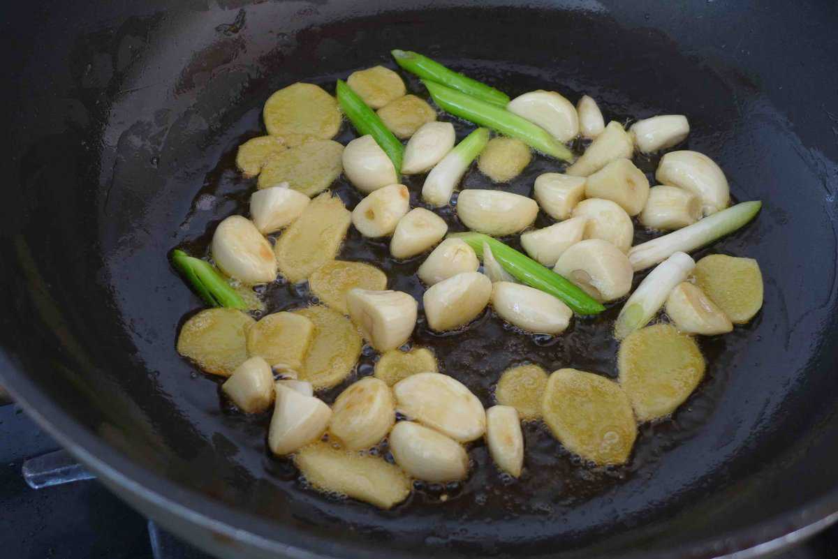 frying garlic, ginger and scallion white in sesame oil.