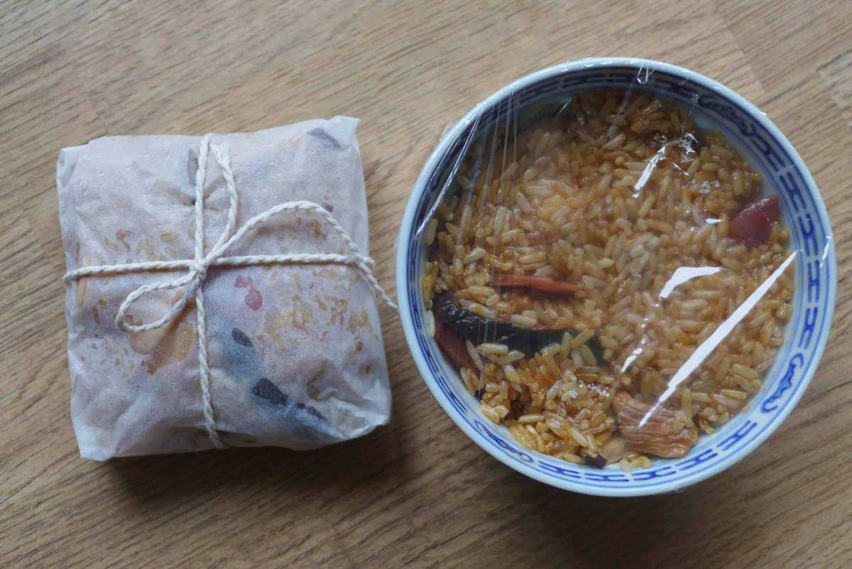 stick rice and chicken in a bowl and wrapped in parchment paper.