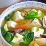 a bowl of tofu soup with vegetables with overlay text that says Chinese tofu soup.