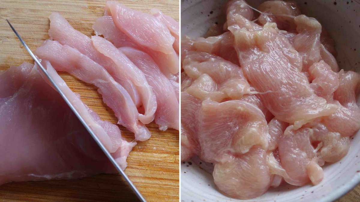 cutting chicken breast into slices.