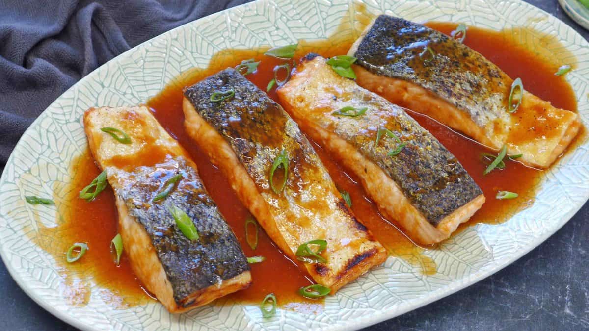 sweet and sour salmon on a plate.