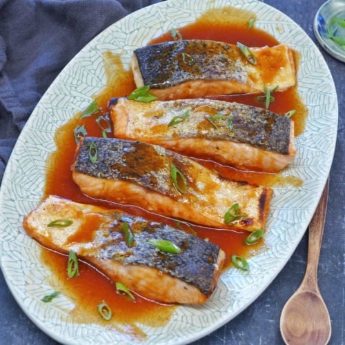 A plate of sweet and sour salmon.