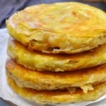A stack of four pan-fried flatbread.