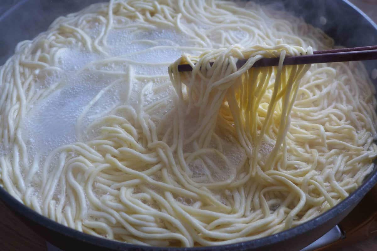 boiling Yi Mein noodles.