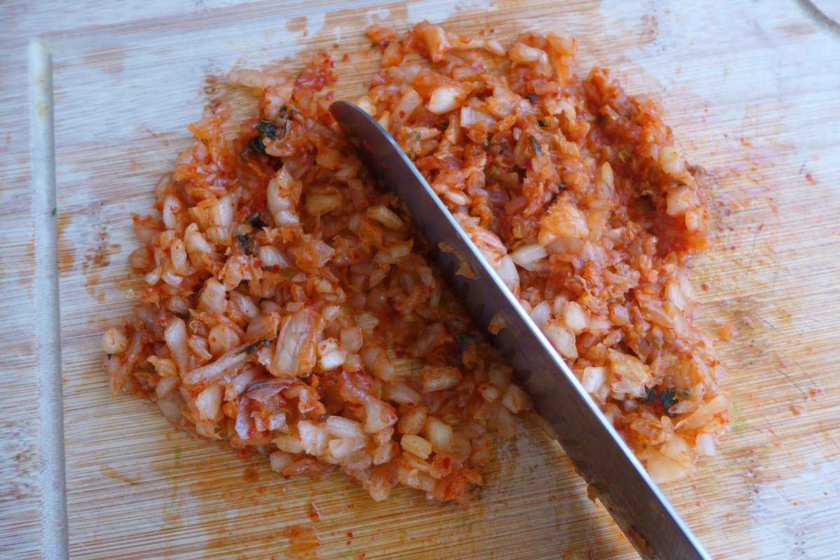 chopping kimchi.