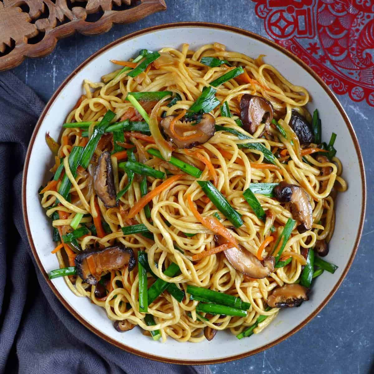 longevity noodles with mushroom, carrot and Chinese chives.